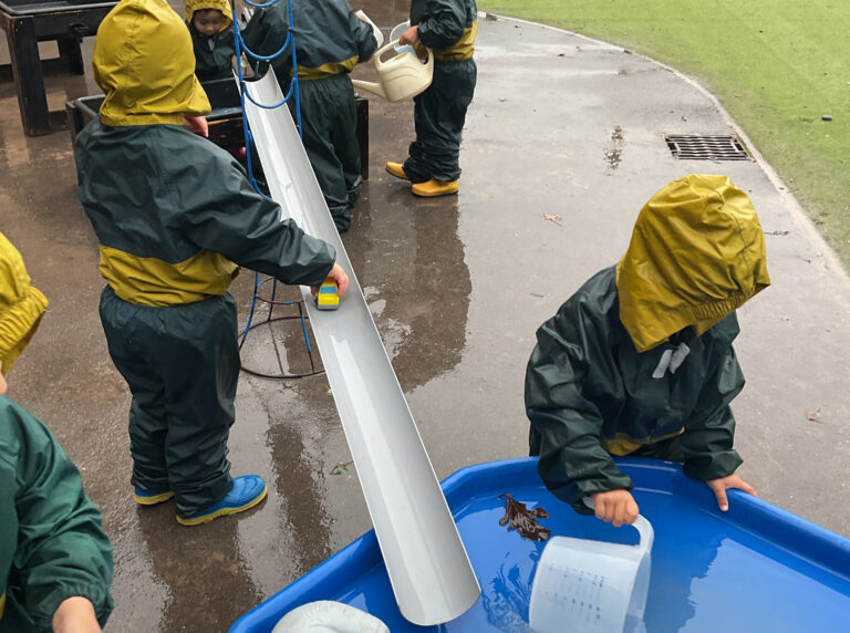 EYFS exploring water, in the rain!